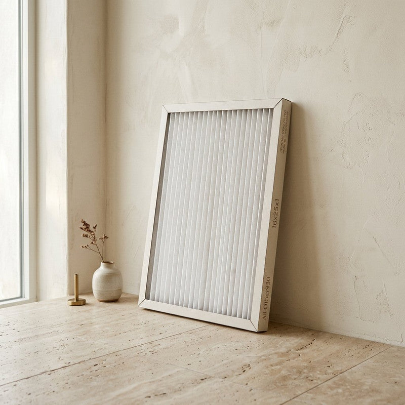 Premium Pleated HVAC Air Filter 16x25x1 leaning against wall